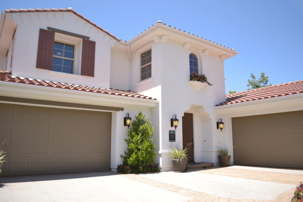 a white house with a garage