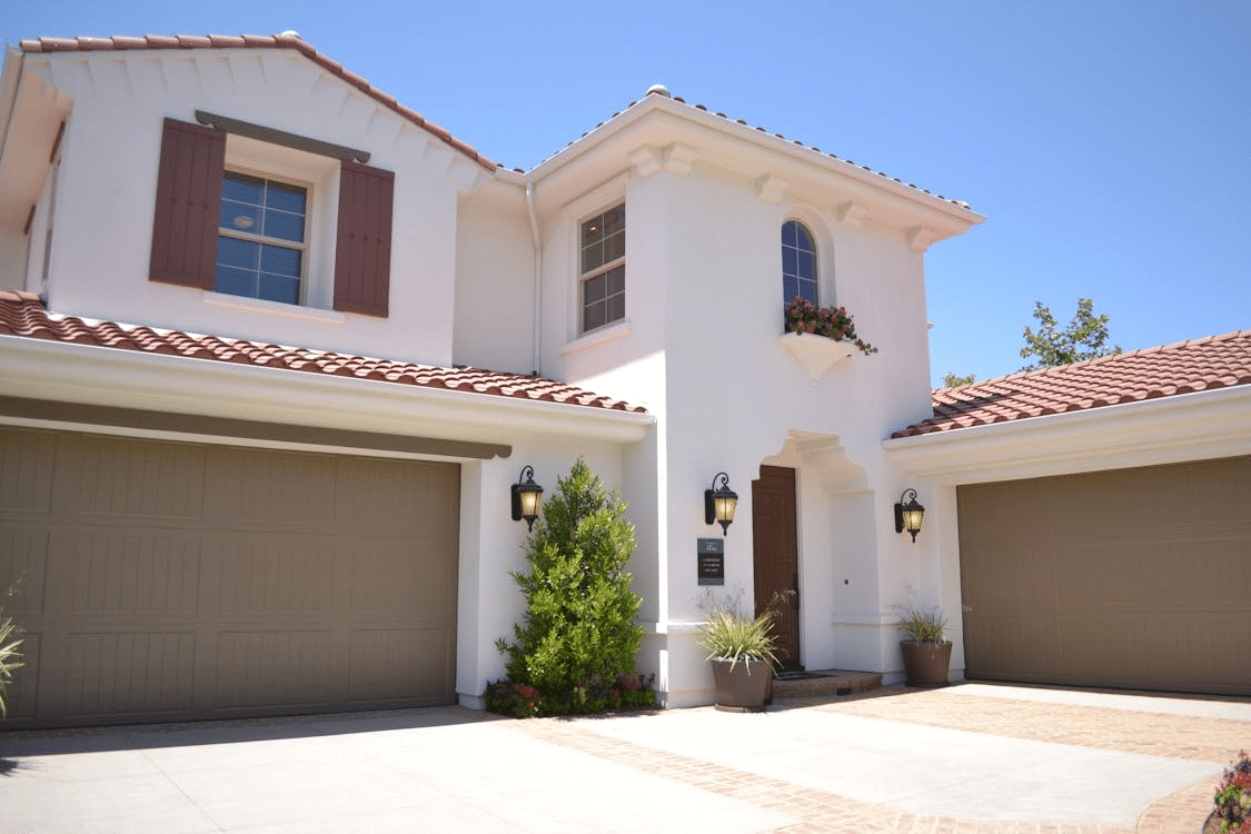 a white house with a garage