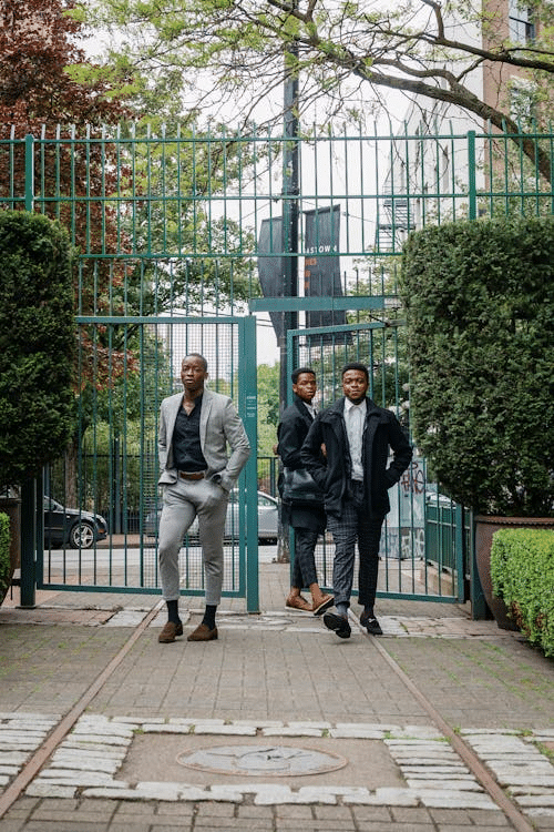Three men walking through a commercial gate