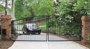 Black residential driveway gate installation in Vancouver